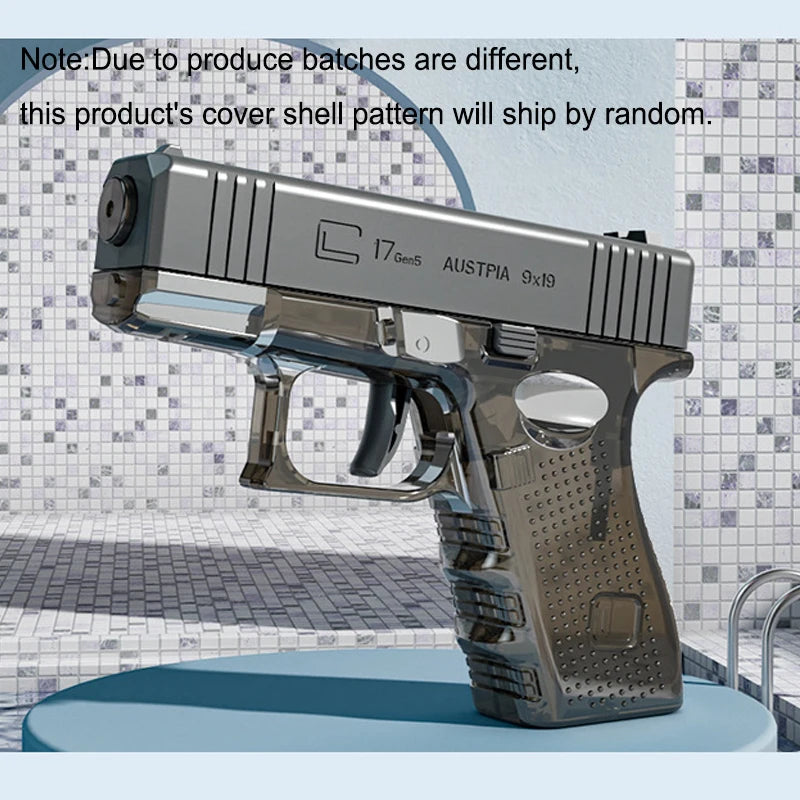 A silver high-power water blaster gun is displayed on a surface.
