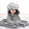 A gray elephant hooded bath towel for babies is shown lying down.