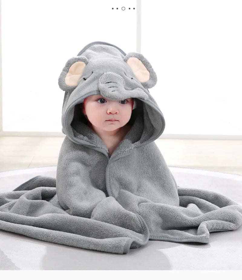 A gray elephant hooded bath towel for babies is shown lying down.