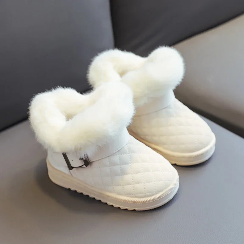 Pair of white snow boots with plush white faux fur lining and a crystal bowknot detail