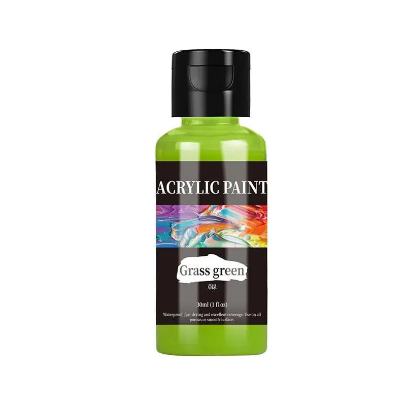 A green bottle of acrylic paint with a black cap and a label reading Grass green.
