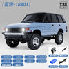 A light blue 1:18 scale RC crawler truck with a black roof and tires, shown in a side view.