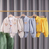 A display of a kids' cartoon bear corduroy tracksuit set featuring jackets and pants in various pastel colors.