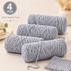 Four skeins of soft gray chenille yarn for crochet and knitting projects
