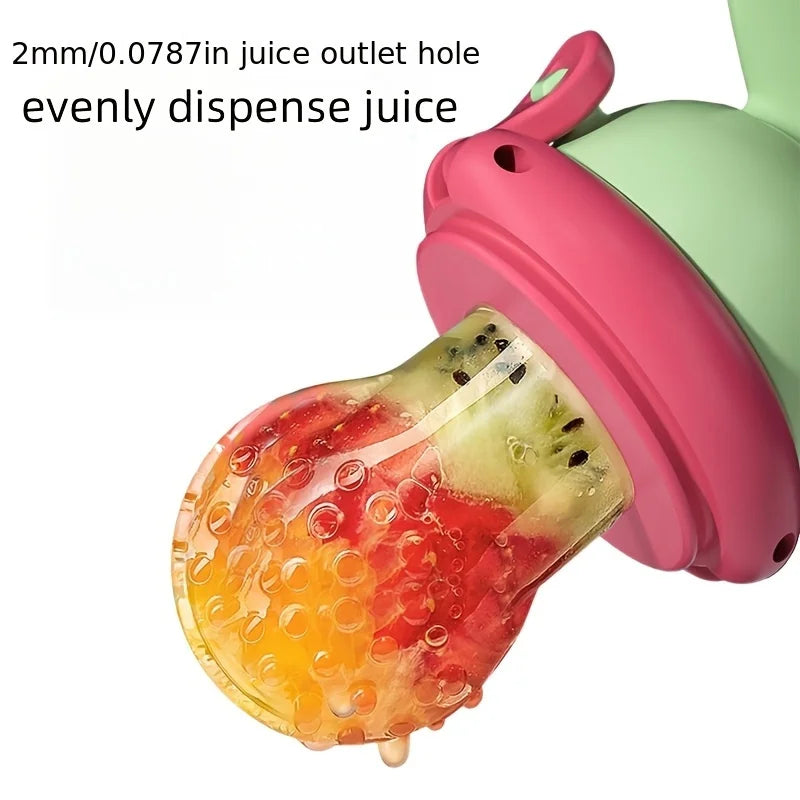 A pink and green dinosaur-shaped fruit feeder with a juice outlet hole dispensing fruit juice.