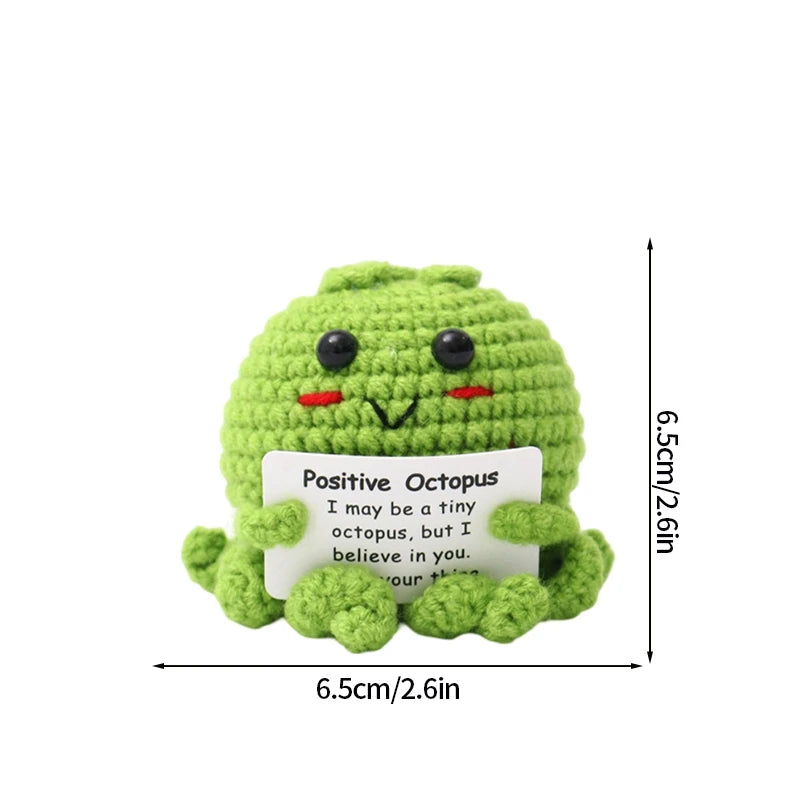 Handmade crochet pocket hug doll shaped like a green octopus with a positive inspirational message