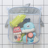 A gray storage bag with suction cups holds various duck and frog toys for bathroom or shower use.