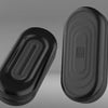 A black EDC push slider fidget toy with a smooth, oval shape shown from the side.