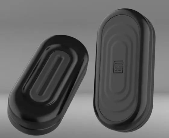 A black EDC push slider fidget toy with a smooth, oval shape shown from the side.