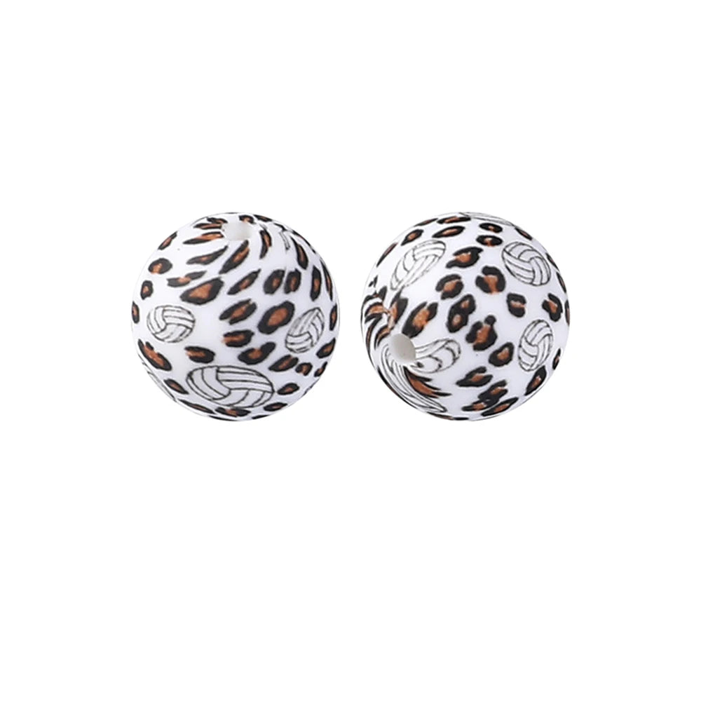 Pair of spherical silicone beads with a leopard print design for jewelry making and crafts