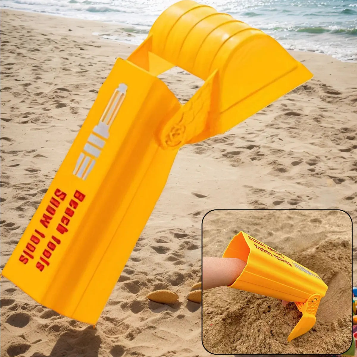 A bright yellow kids excavator digging toy lying on a sandy beach.