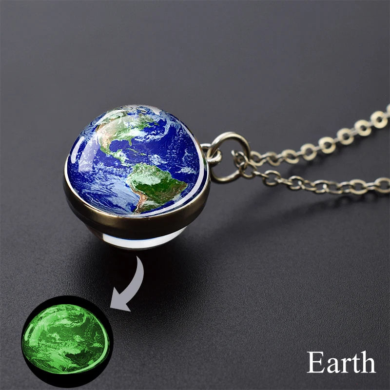 A pendant necklace featuring a miniature Earth sphere with a glow-in-the-dark effect.