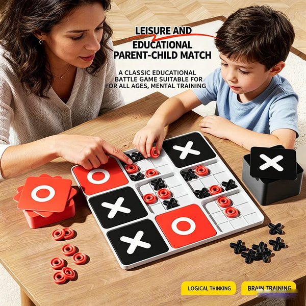 Famille jouant à un jeu de bataille Tic Tac Toe rouge et noir sur une table en bois avec des pièces éparpillées autour.