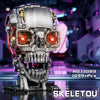 A detailed mechanical skeleton head building kit with LED lights displayed on a dark surface.