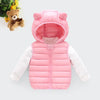 A pink hooded cotton vest for kids with long sleeves and a matching teddy bear in the background.