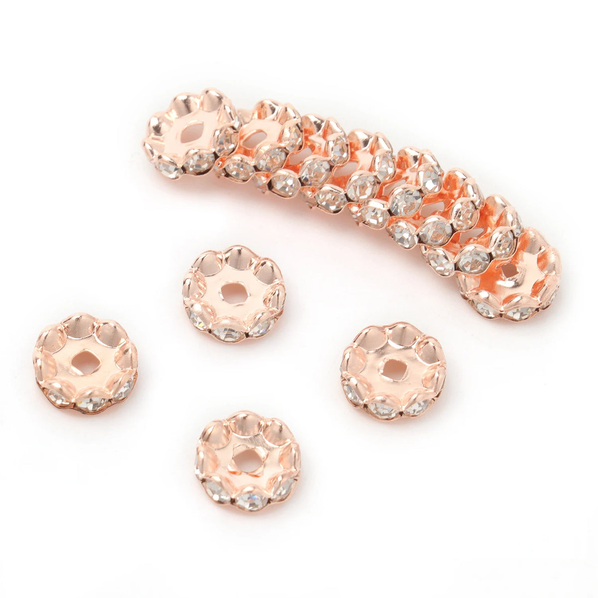 A string of 12mm crystal rhinestone spacer beads in rose gold color for jewelry making