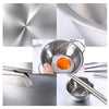 A collection of stainless steel cookware and utensils, including a large pot, bowls, and various tools for a play kitchen set