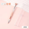 A pink gradient rotating dotting pen is shown next to its clear storage case.