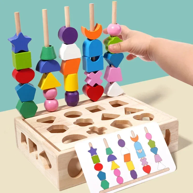 A hand is sorting colorful wooden shapes and colors into holes on a wooden block toy for toddlers.