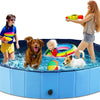 A dog and a girl are playing in a blue inflatable pet bath tub with a quick-drain design.
