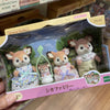 A packaged Sylvanian Families set featuring a deer figure with pink and white clothing.