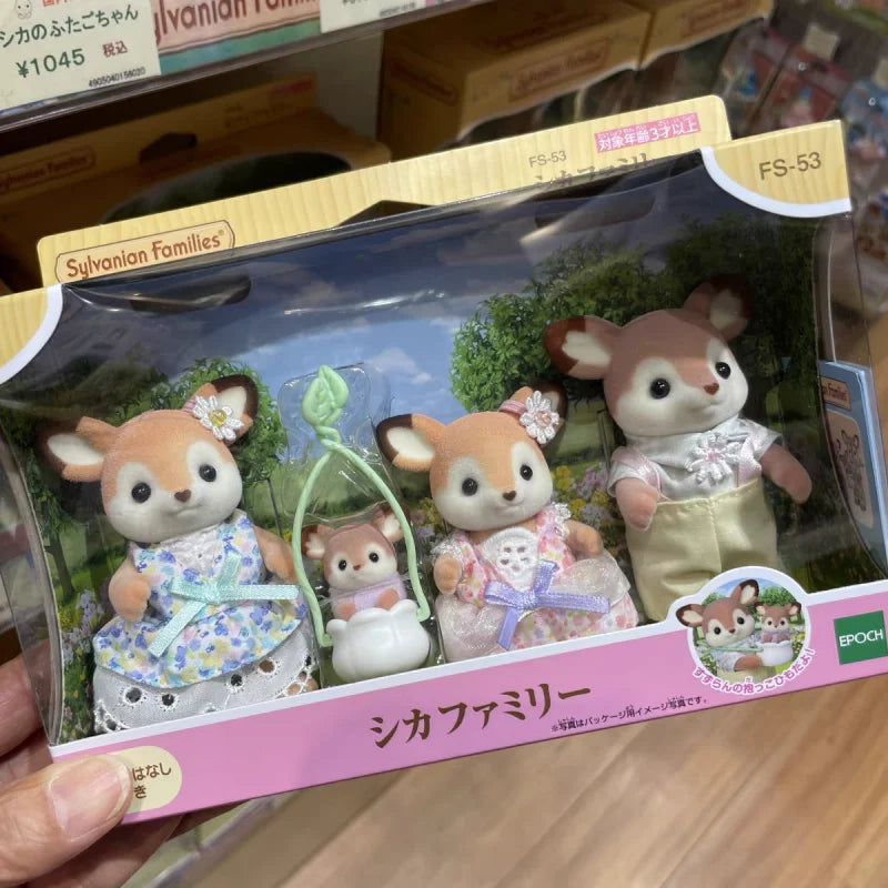 A packaged Sylvanian Families set featuring a deer figure with pink and white clothing.