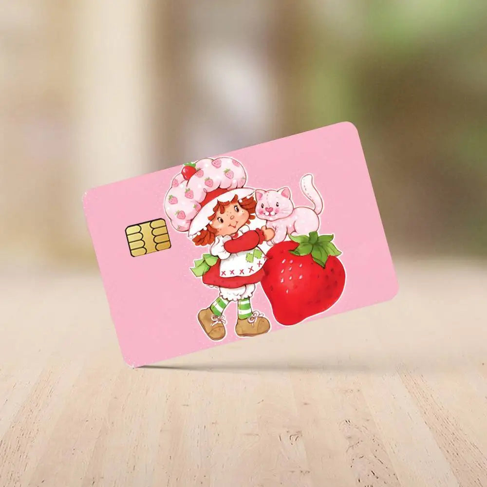 A pink credit card sticker set featuring a cartoon girl, a strawberry, and a kitten.