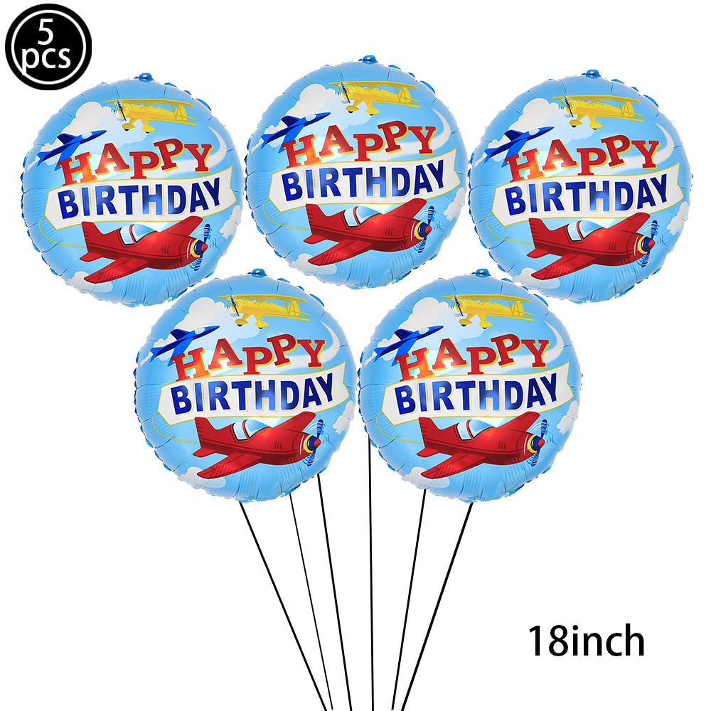 Five blue foil balloons shaped like planes with happy birthday text and strings