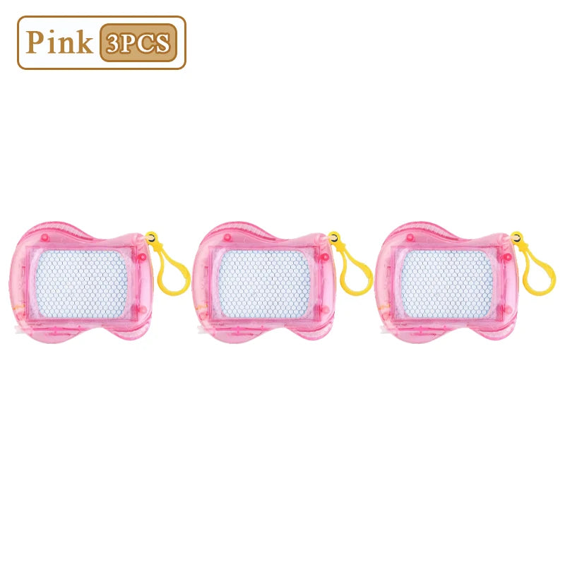 Three pink mini magnetic drawing boards with stylus attached to yellow keychain rings