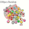 A pile of 100 random colorful mini capsule figures and collectible toys.