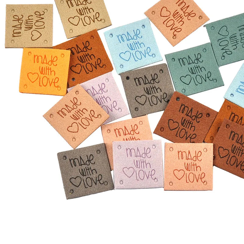 A collection of 20 colorful embossed leather labels with the text Made with Love for sewing and crafts.