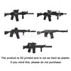 Three 3D printed military gun models with various accessories displayed against a white background.