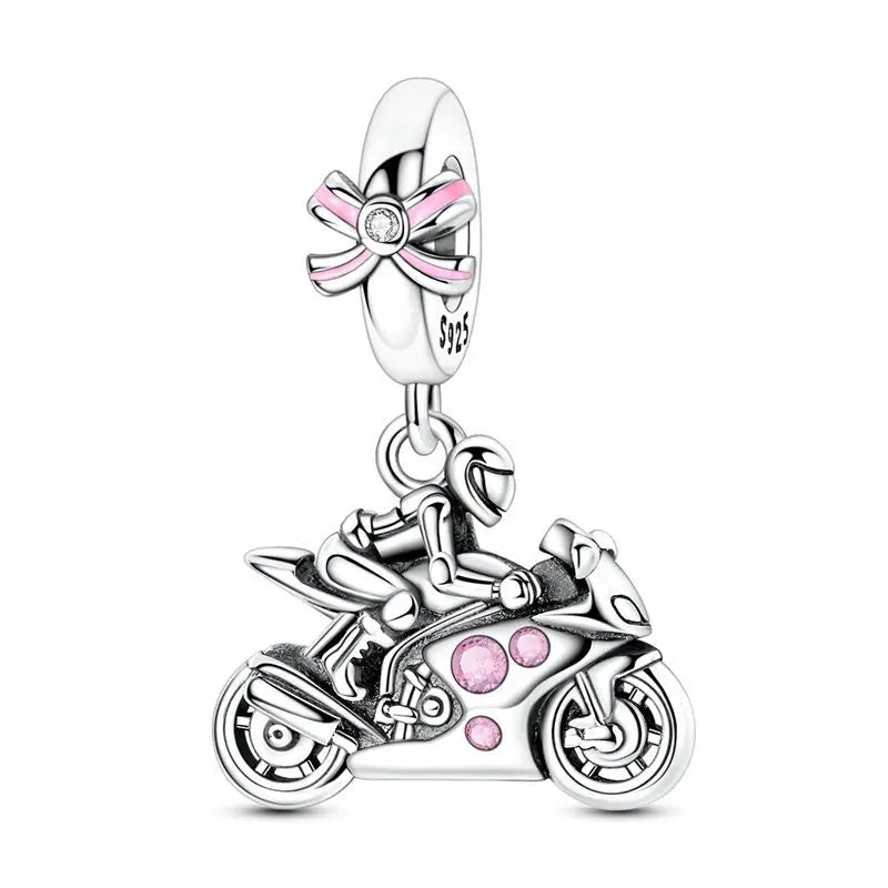 A silver heart charm bead with a pink zircon detail and a decorative ribbon.