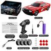 A red high-speed 4WD drift RC car with its box, remote control, battery, and accessories.