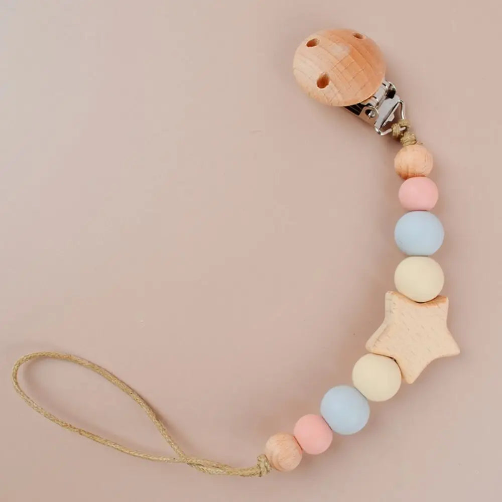 A wooden baby pacifier clip featuring silicone beads in pastel colors and a star shape.
