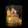 A detailed wooden Windsor Castle dollhouse kit with LED lighting and furniture displayed in a glass box.