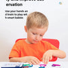 A young boy is playing with wooden shape sorting puzzles and colorful craft sticks for brain development.