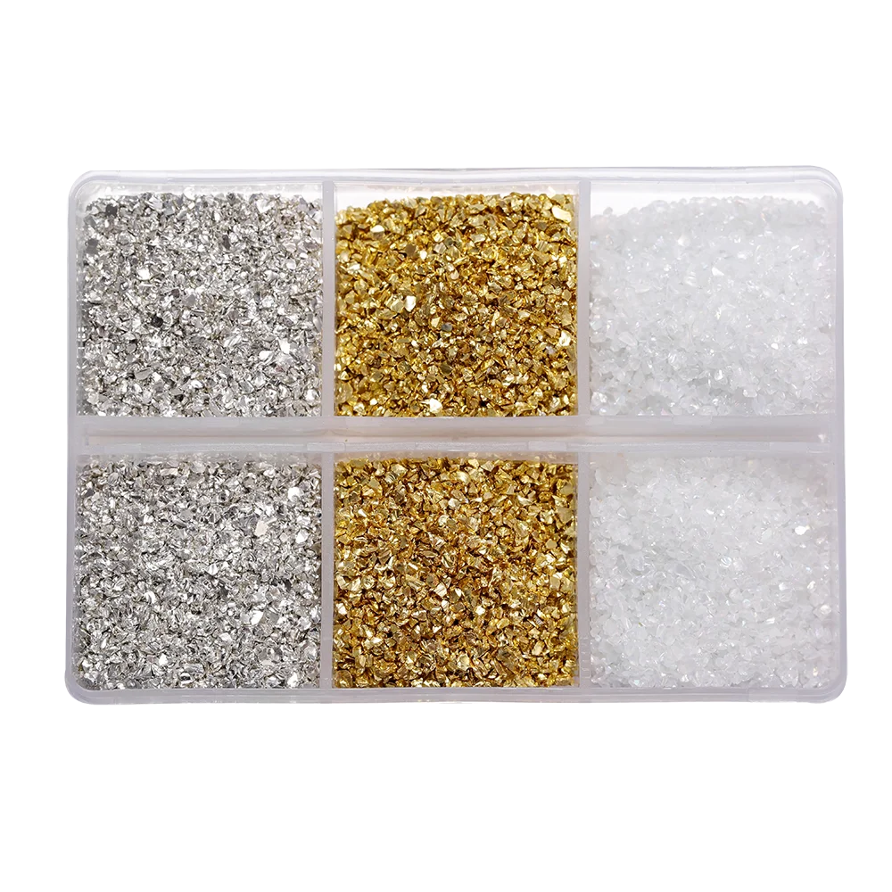 A clear plastic tray divided into four compartments holding different colored crushed glass stones for resin and craft projec
