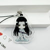 A clear acrylic pendant featuring an anime-style character with long black hair and a white headband, attached to a keychain.
