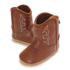 A pair of brown baby western booties with soft non-slip soles.
