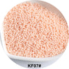 A pile of light pink, spherical glass seed beads for jewelry and craft.
