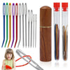 A set of large eye stainless steel sewing needles with a wooden storage tube and a red cap.