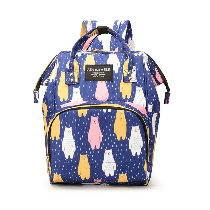 A blue cartoon print waterproof diaper bag featuring yellow and pink cats for travel.