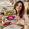 A woman holds an adult coloring book featuring a colorful graffiti mandala design.