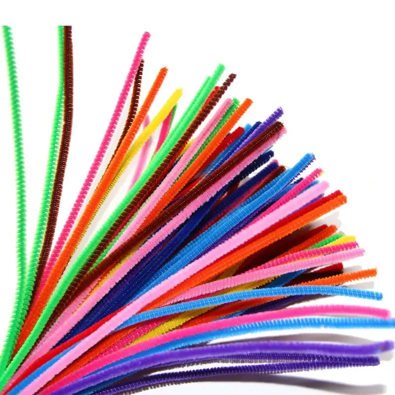 A bundle of assorted chenille craft stems in various bright colors like green, orange, pink, and blue.