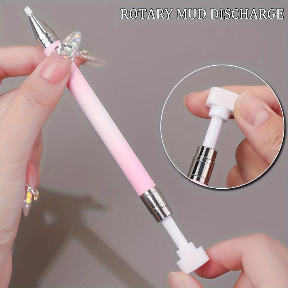 A hand is holding a pink and silver rotary mud discharge pen for nail art, demonstrating its use.