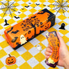 An orange Halloween butter squishy toy set featuring a pumpkin and ghost stress relief fidget on a yellow checkered surface.