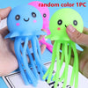 Three random color squeeze octopus bath toys are shown being held by a hand.