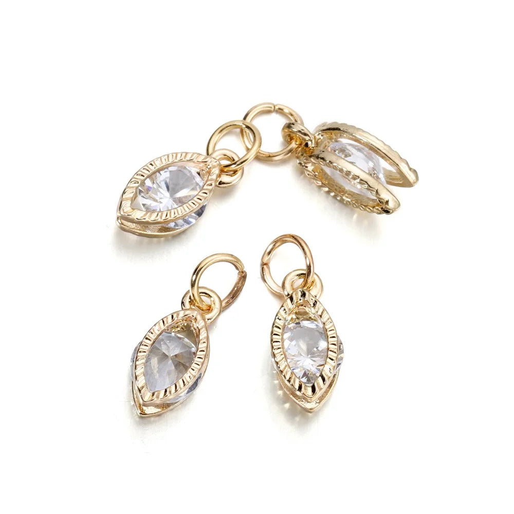 Gold-toned rhinestone heart charms for jewelry making, shown as separate pendants.