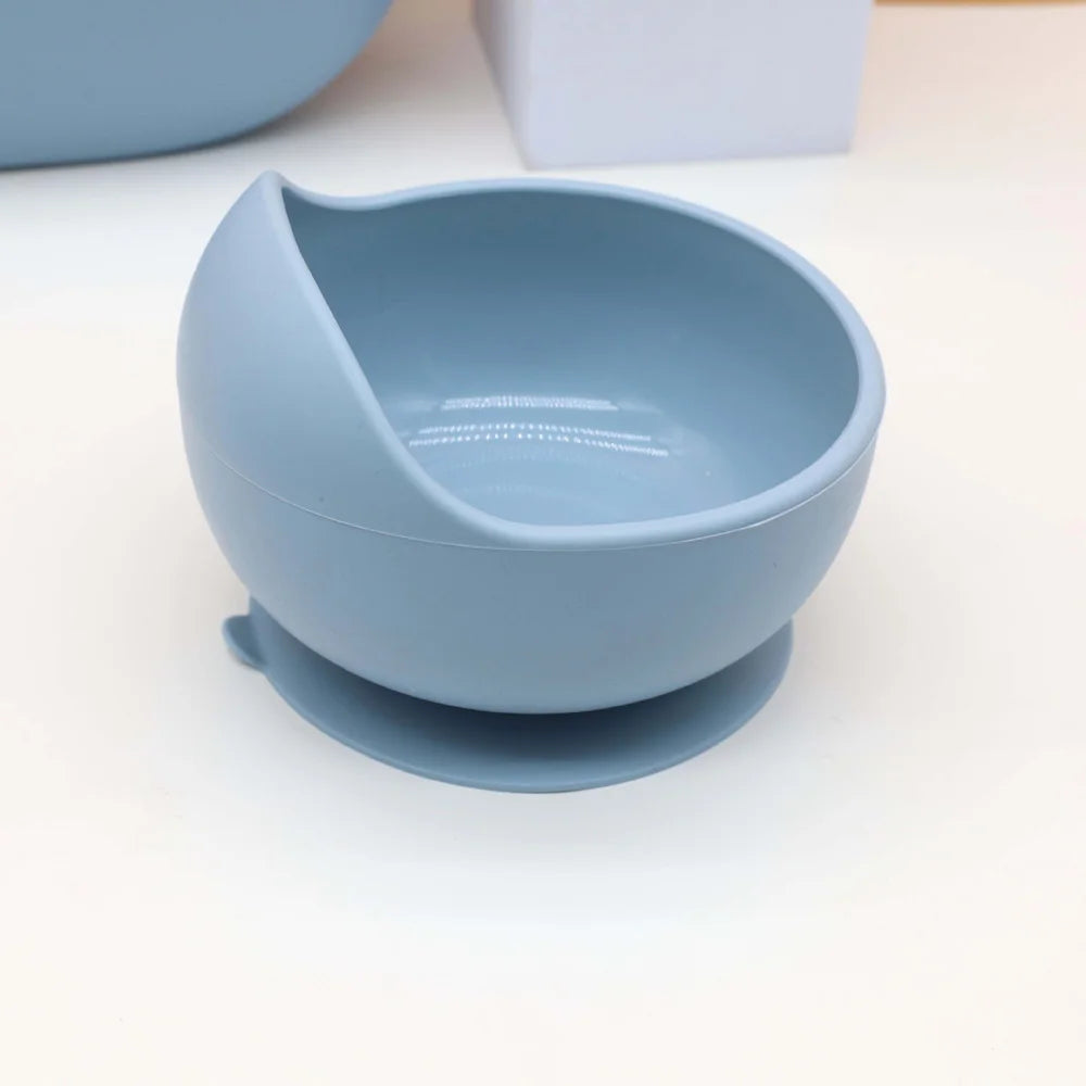 A light blue silicone bowl and plate set for baby tableware